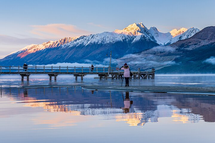 Experience breathtaking landscapes and learn the art of photography while capturing stunning reflections of snow-capped mountains and serene waters on this unforgettable journey from Queenstown to Glenorchy.